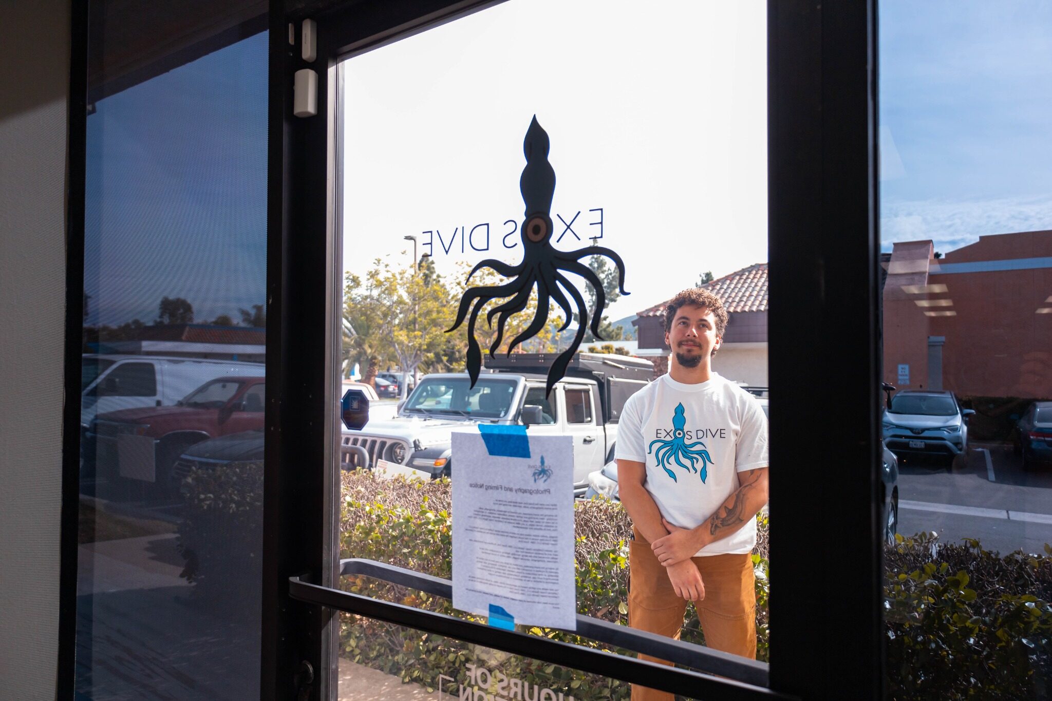 EXO Dive team member standing outside the grand opening