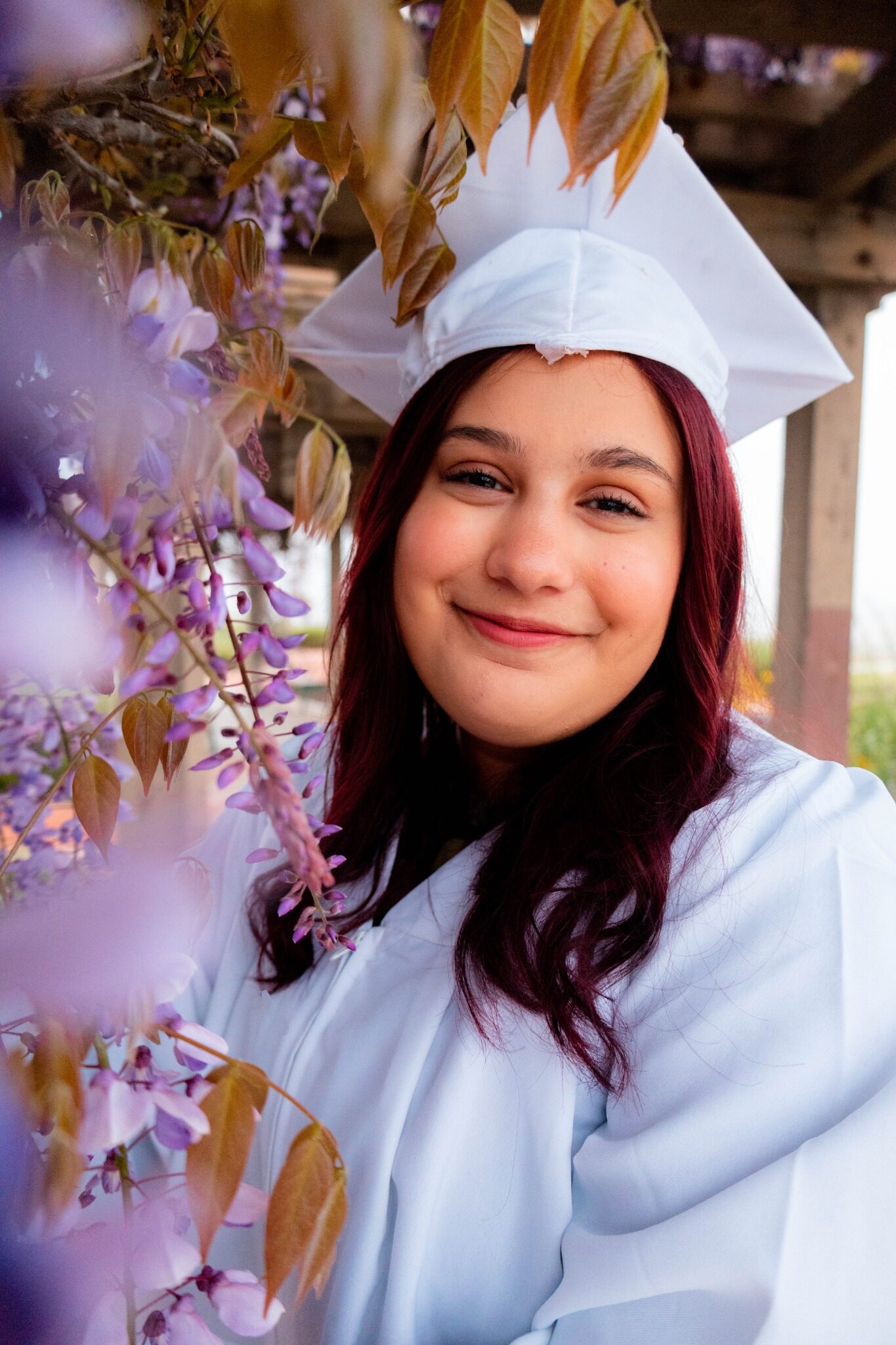Graduate framed by lavender flowers