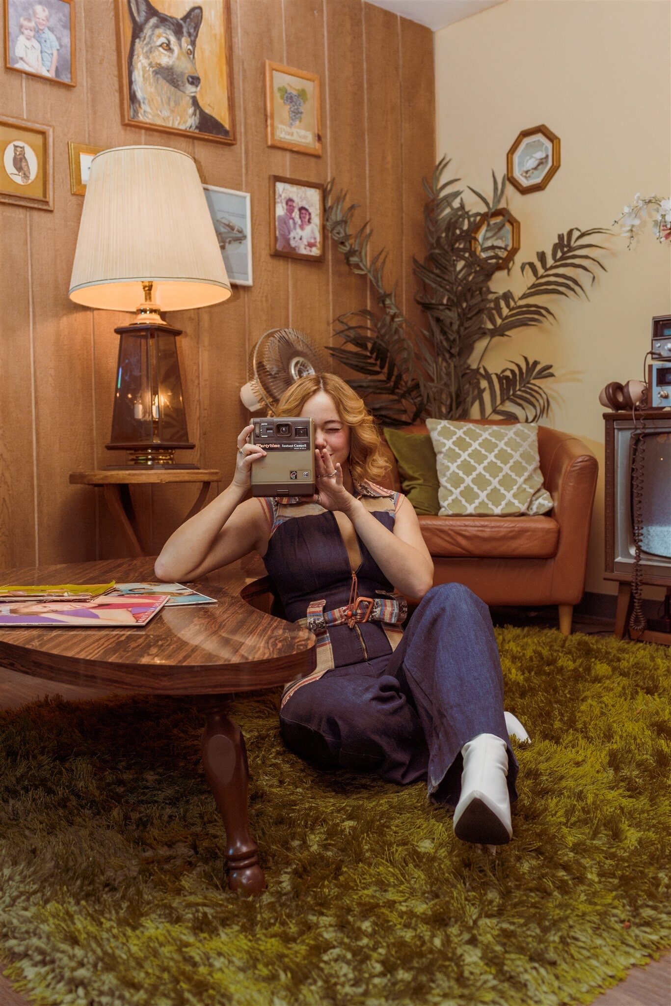 Woman creating a photograph with a vintage instant camera