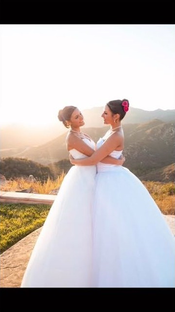 Couple embracing in formalwear at golden hour